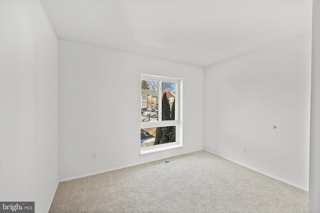 unfurnished room with carpet floors