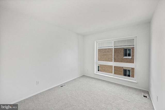 empty room with carpet flooring