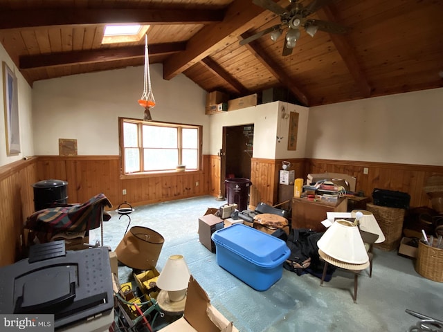 misc room with wood ceiling, ceiling fan, vaulted ceiling with skylight, and light carpet