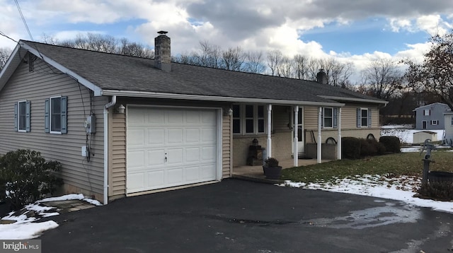 single story home featuring a garage