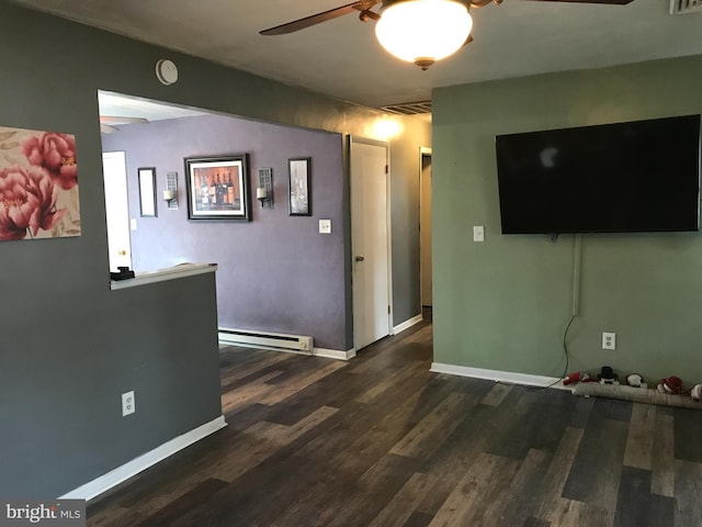 living room with baseboard heating, ceiling fan, and dark hardwood / wood-style floors