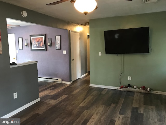 living room featuring dark wood-type flooring, a baseboard radiator, and ceiling fan