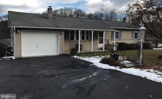 single story home featuring a garage