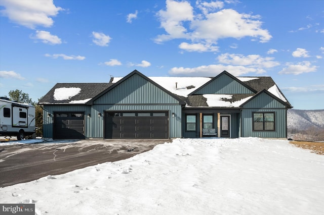 modern inspired farmhouse with a garage