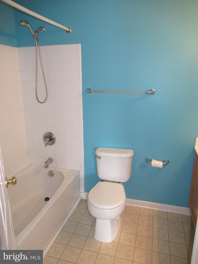 full bathroom with vanity, toilet, and tiled shower / bath combo