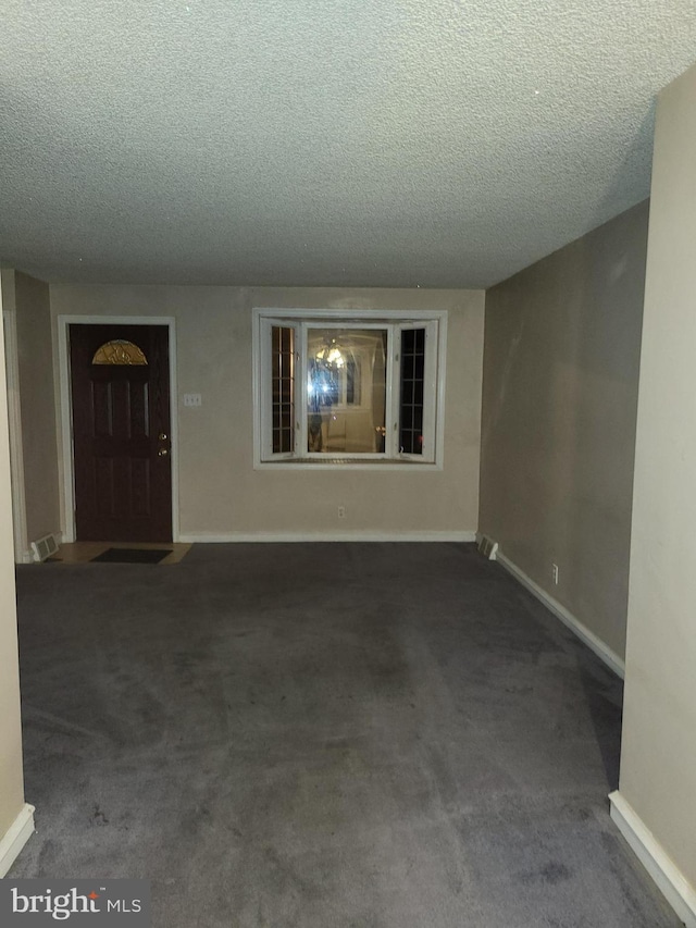 interior space featuring a textured ceiling