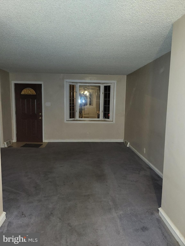 interior space with a textured ceiling