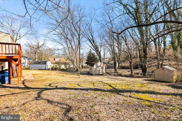 view of yard with an outdoor structure and a storage shed