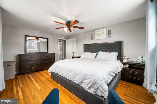 bedroom featuring hardwood / wood-style floors and ceiling fan