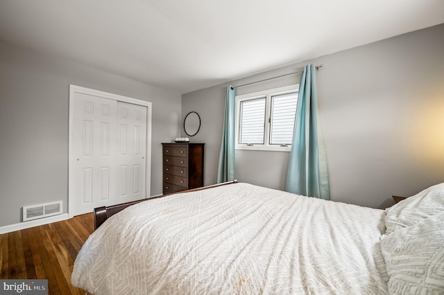 bedroom featuring hardwood / wood-style flooring and a closet