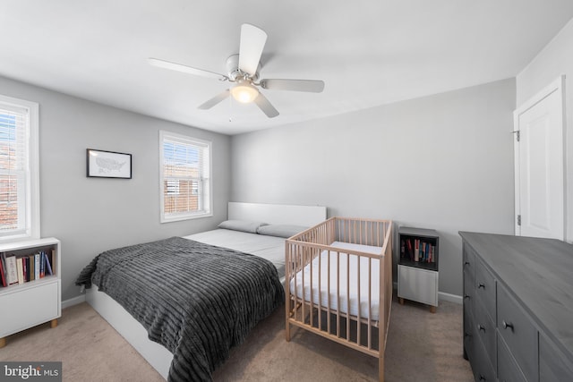 carpeted bedroom featuring ceiling fan