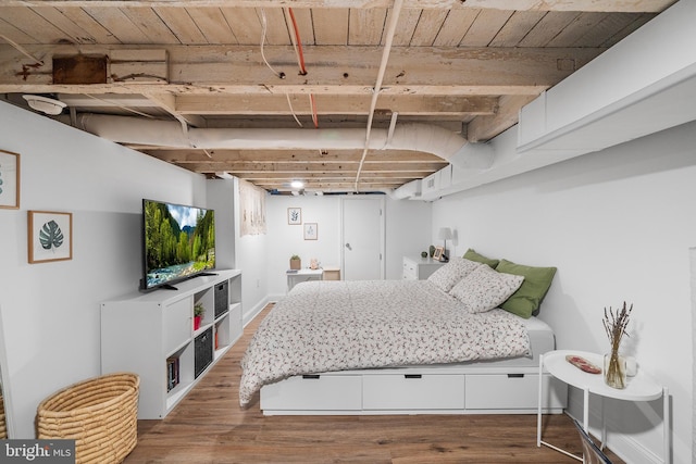 bedroom with hardwood / wood-style floors and wooden ceiling