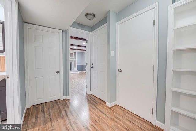 corridor featuring light wood-type flooring