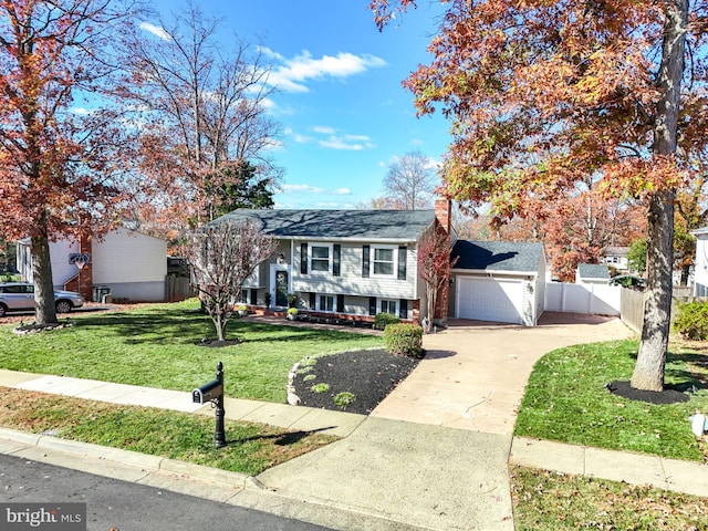 view of front of house with a garage and a front yard