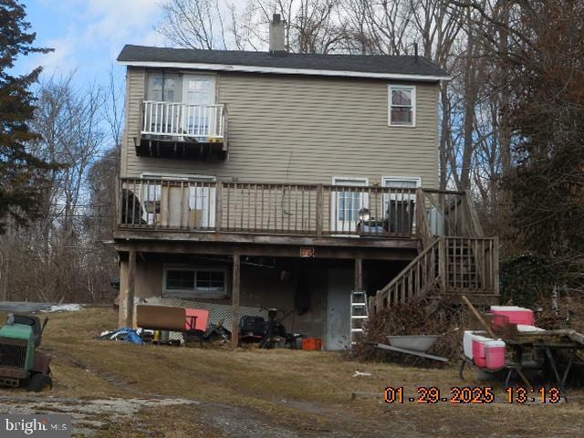 rear view of property with a deck