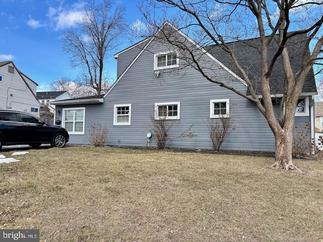 view of side of property featuring a yard