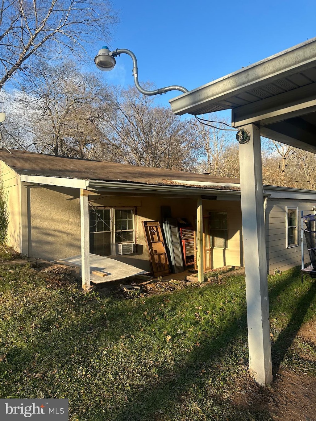 back of house featuring a yard and a patio area