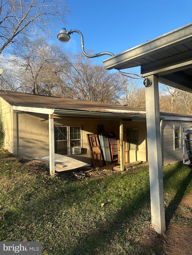 back of house featuring a yard and a patio area