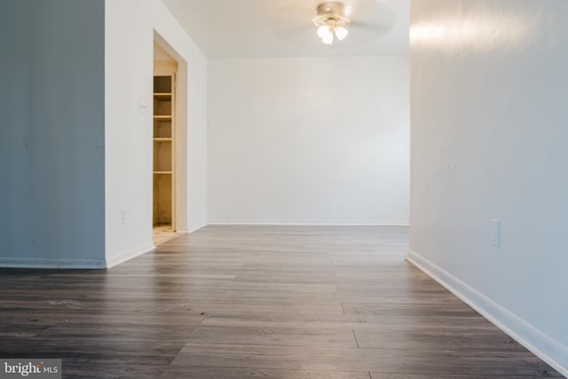 unfurnished room featuring dark hardwood / wood-style floors and ceiling fan