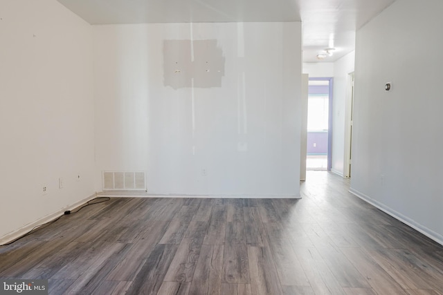 spare room with wood-type flooring