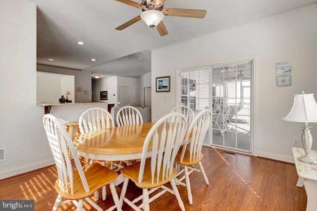 dining room featuring hardwood / wood-style flooring and ceiling fan