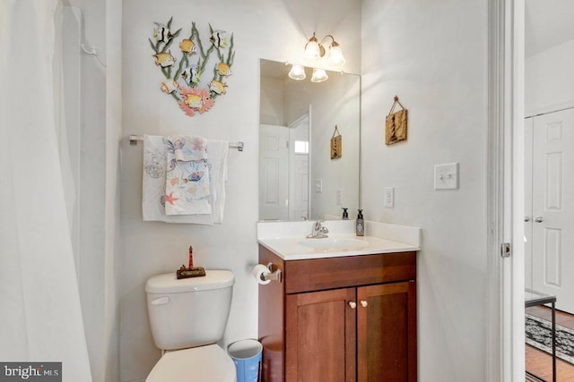 bathroom with vanity and toilet