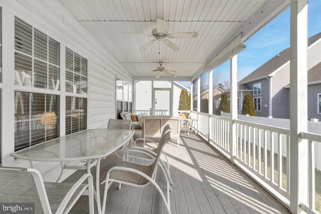 wooden deck featuring ceiling fan