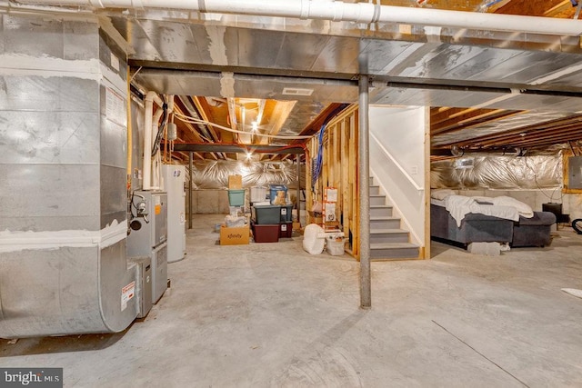 basement with electric panel and water heater