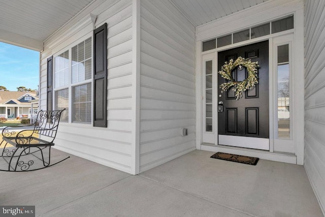 property entrance featuring a porch