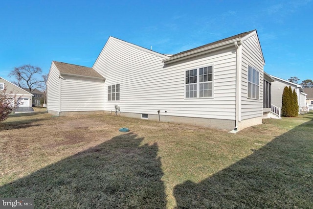 back of house featuring a yard