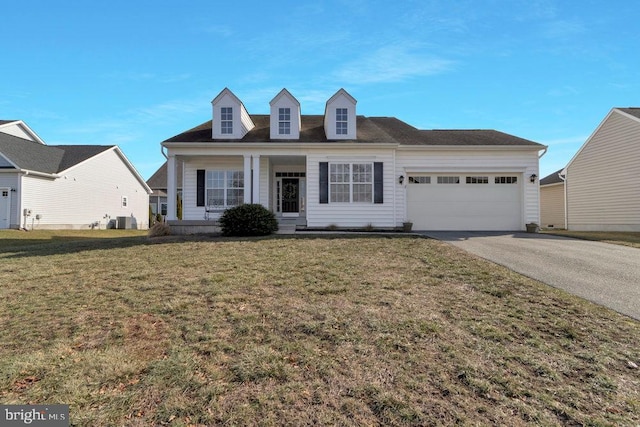 cape cod home featuring central AC unit, a garage, a front yard, and a porch