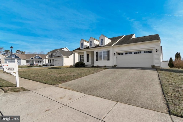 view of front of home with a garage and a front yard