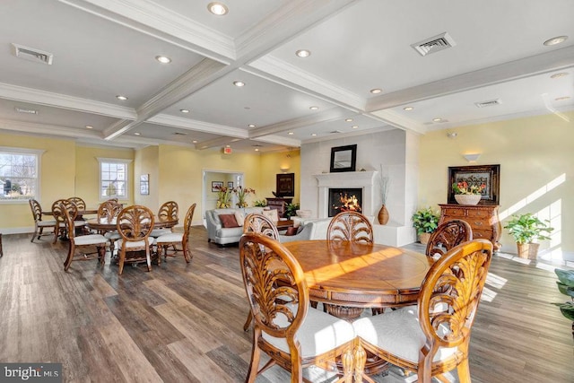 dining room with crown molding, wood-type flooring, beam ceiling, and coffered ceiling