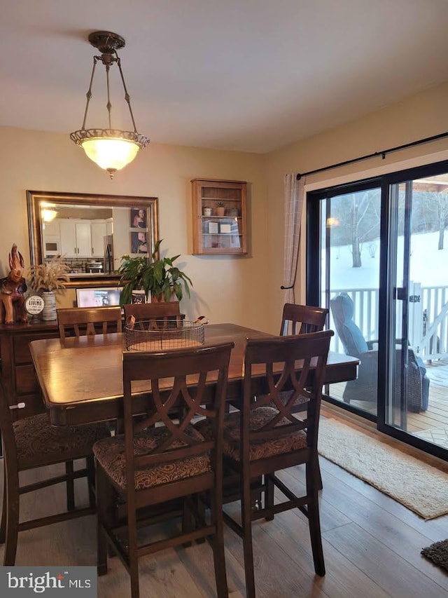 dining area with hardwood / wood-style floors