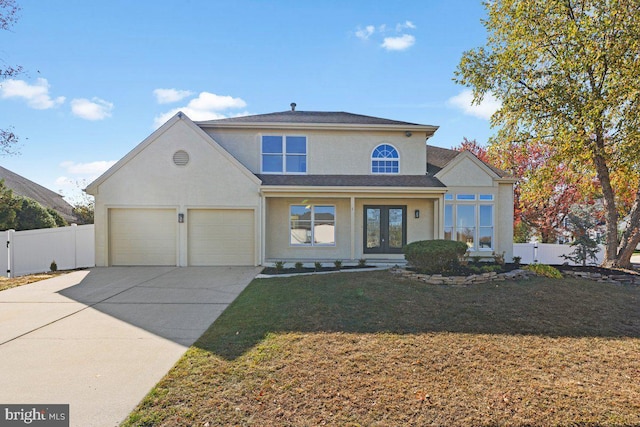 front of property with a front lawn and french doors