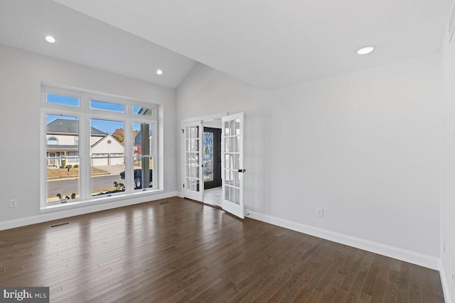 unfurnished room with french doors, dark wood-type flooring, and vaulted ceiling