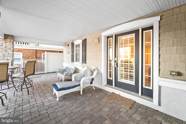 view of patio featuring a porch