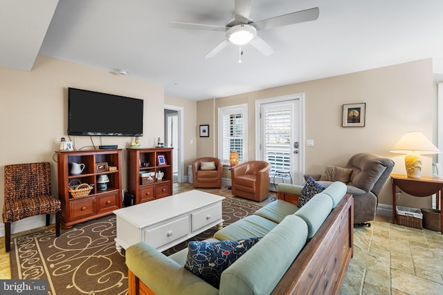 living room featuring ceiling fan