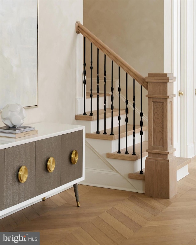 staircase with parquet flooring