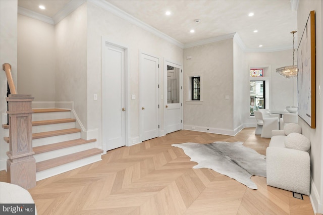 entryway featuring ornamental molding and light parquet flooring