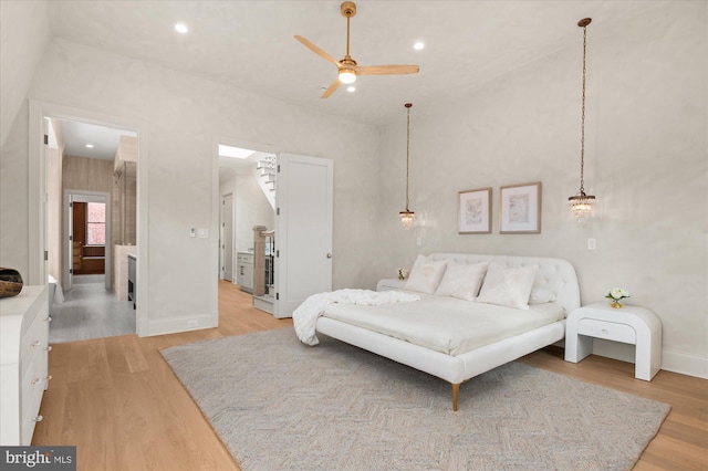 bedroom featuring light hardwood / wood-style floors and ceiling fan