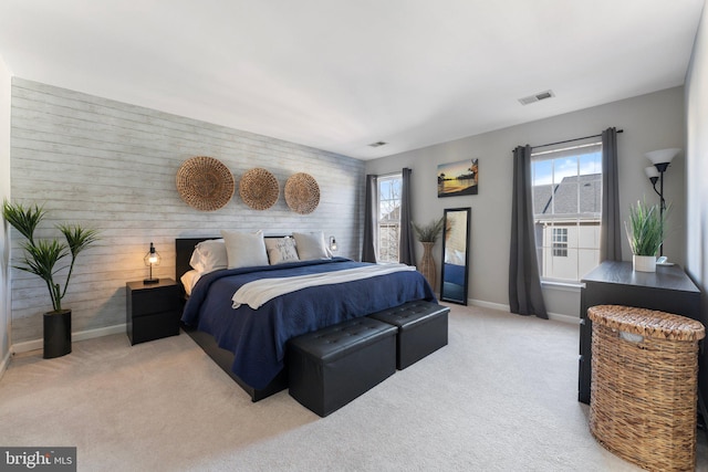 bedroom featuring light colored carpet