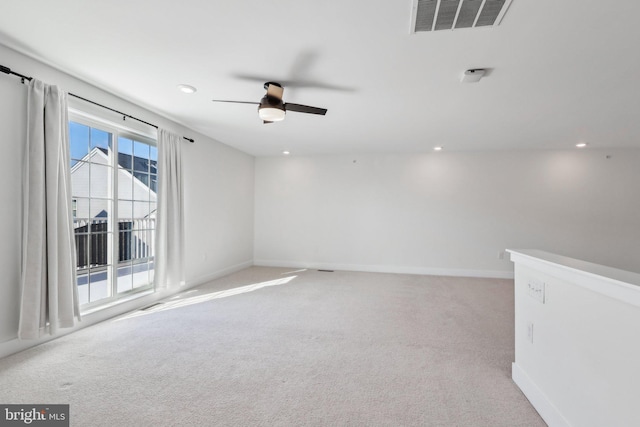 carpeted empty room with ceiling fan