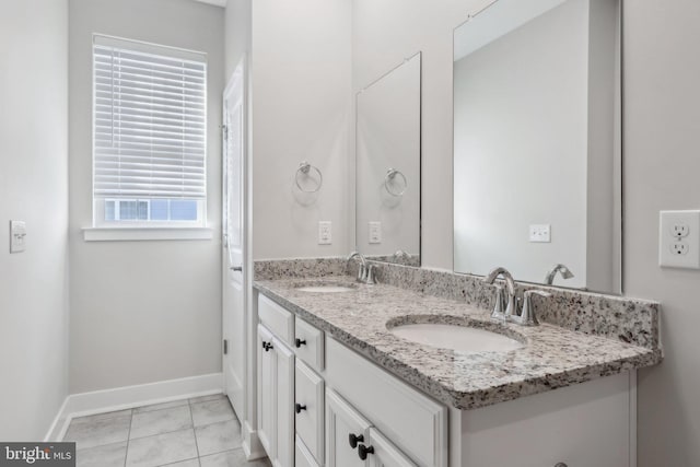 bathroom with vanity and tile patterned flooring