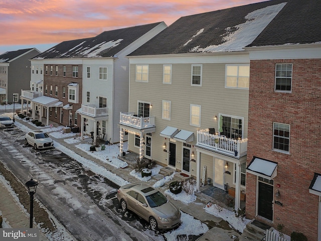 view of outdoor building at dusk