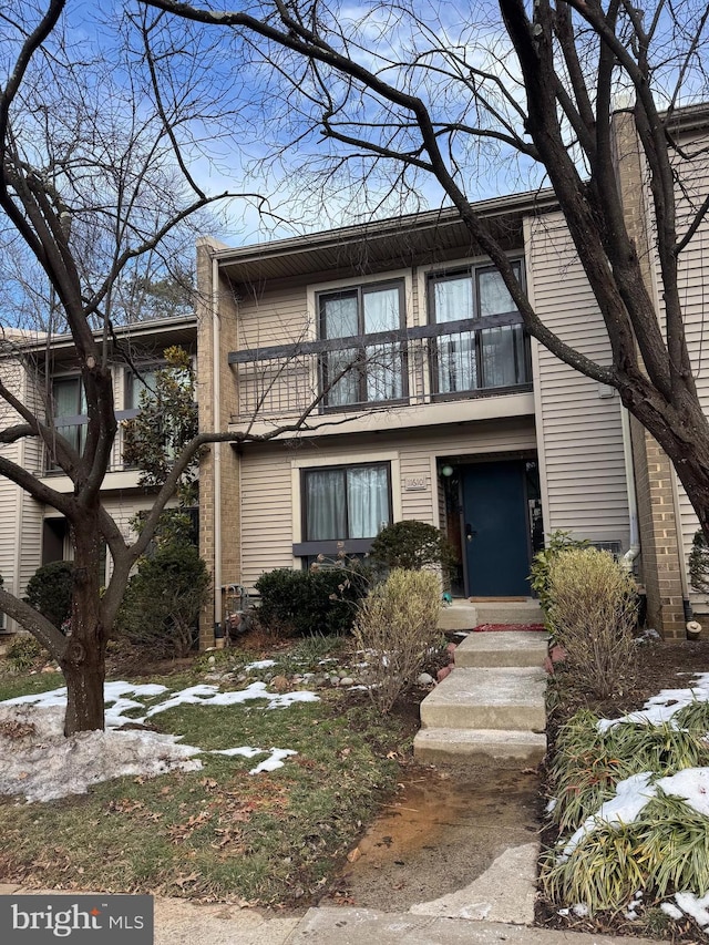 multi unit property featuring a balcony