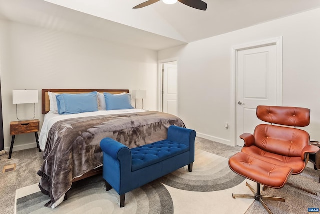 bedroom with ceiling fan, lofted ceiling, and light carpet