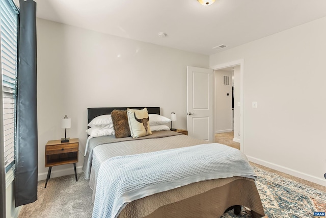 bedroom with light colored carpet