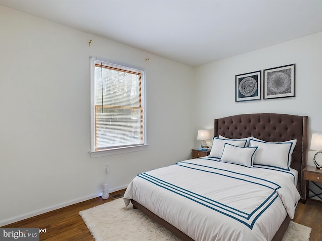 bedroom featuring dark hardwood / wood-style floors