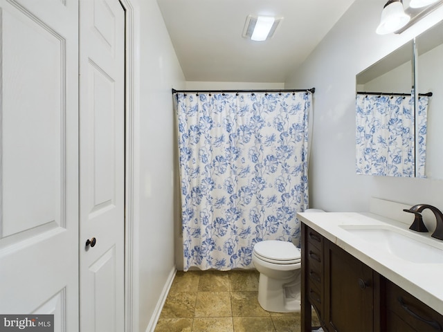 bathroom with vanity, walk in shower, and toilet